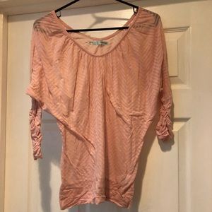Sheer, pink quarter sleeved shirt.